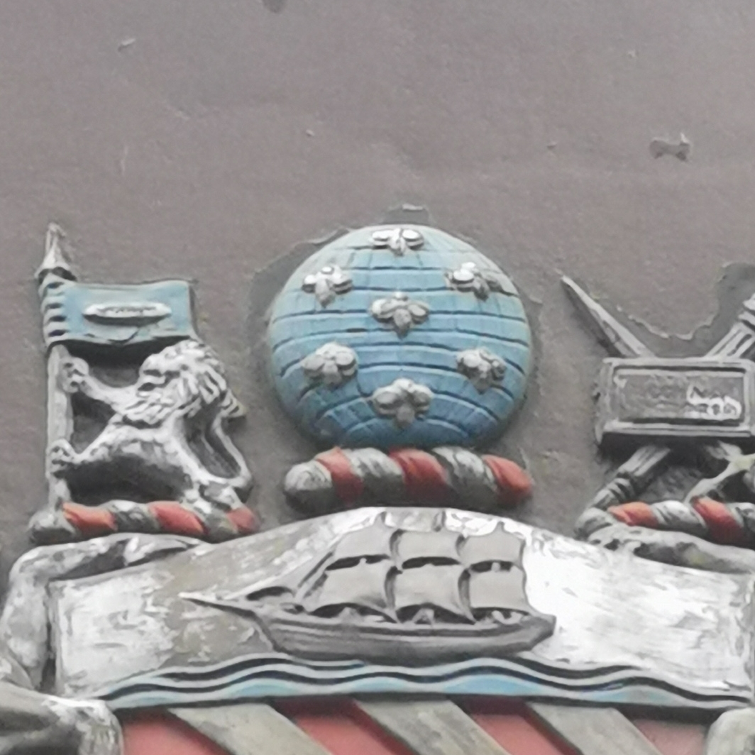 Seven bees on globe at Ship Canal House, King Street