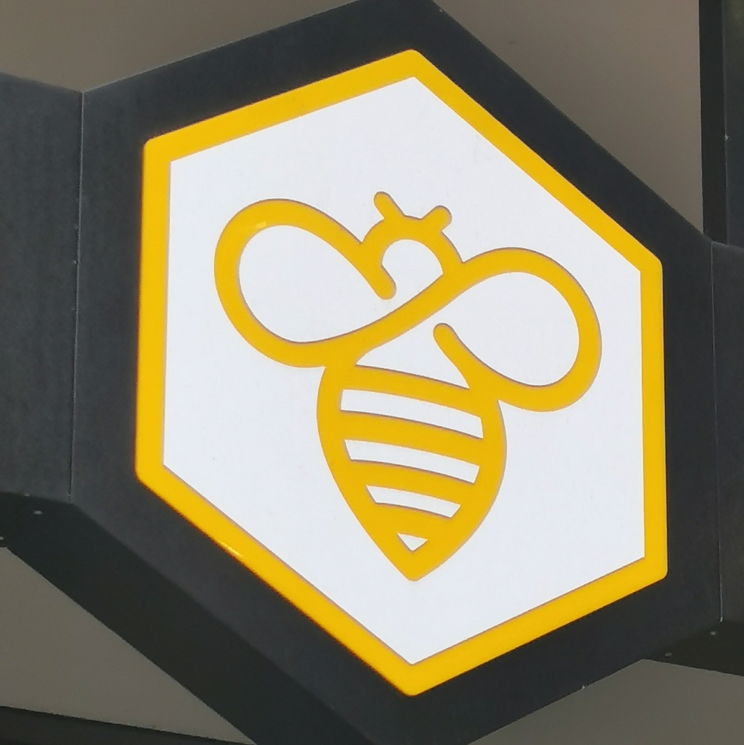Bee logo at The Coffee Hive, Piccadilly Place