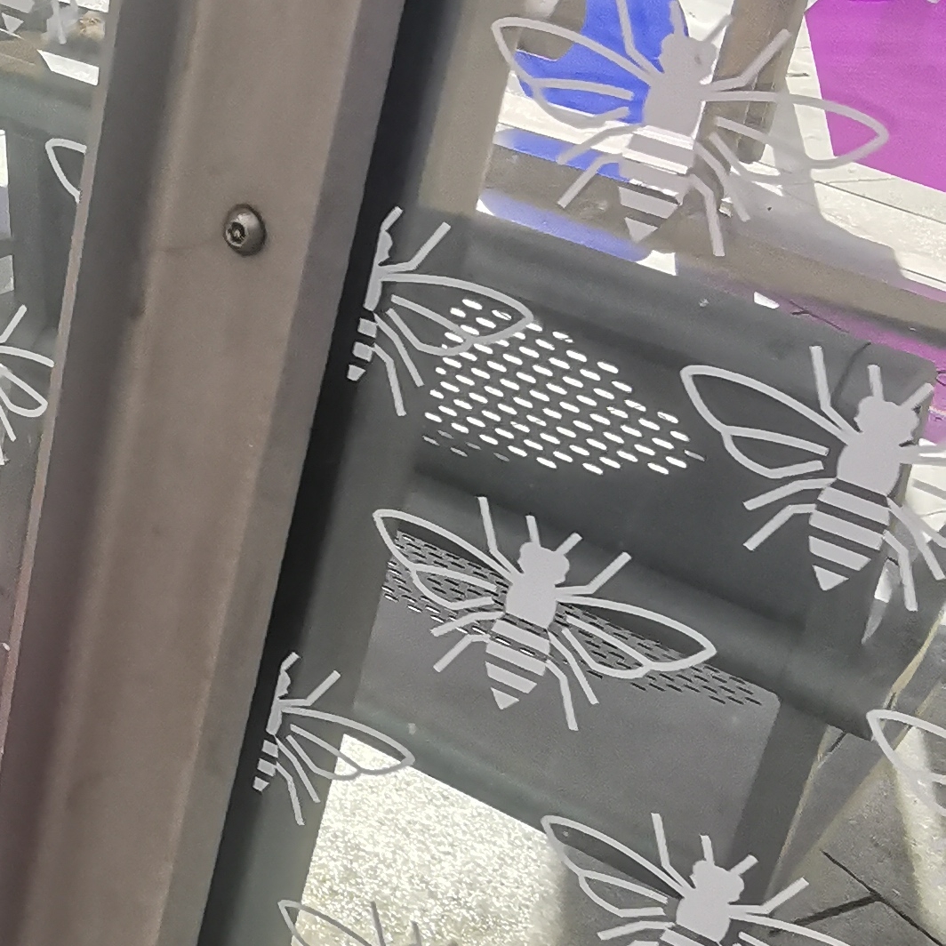 Bees on bus shelter near Piccadilly railway station