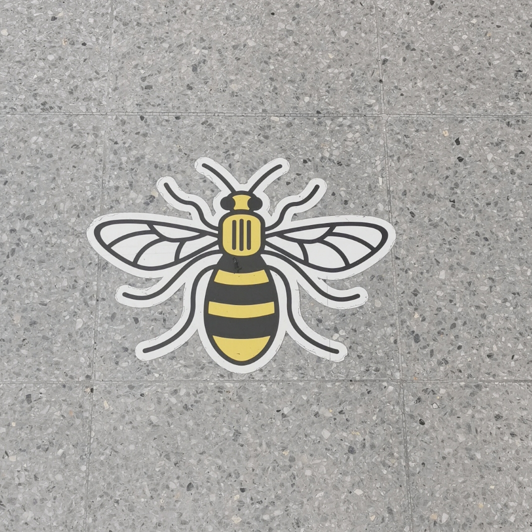 Manchester bee on the floor at Victoria Station