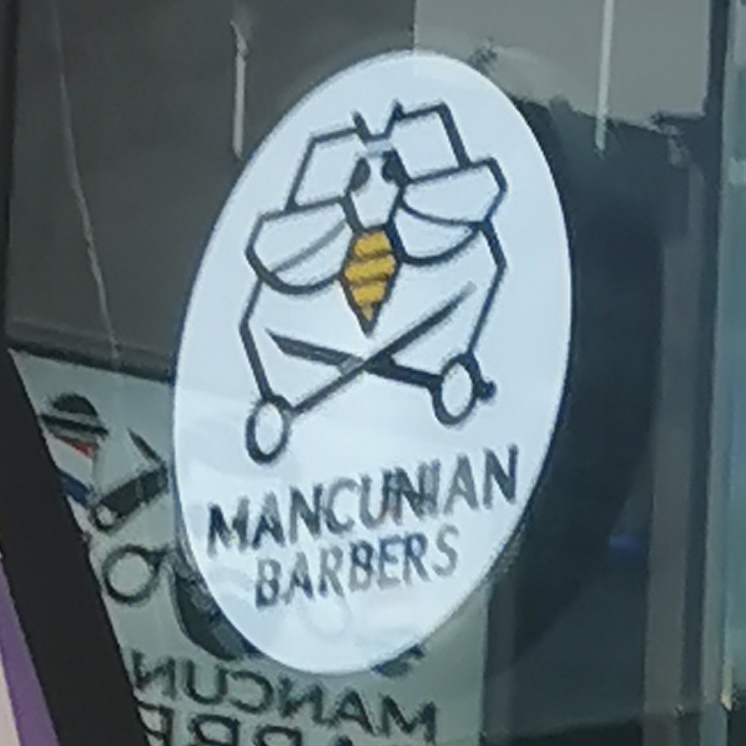 Bee on sign at Mancunian Barbers, Piccadilly