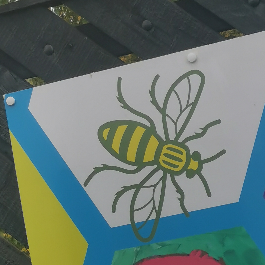 Bee on mural at Ashburys railway station