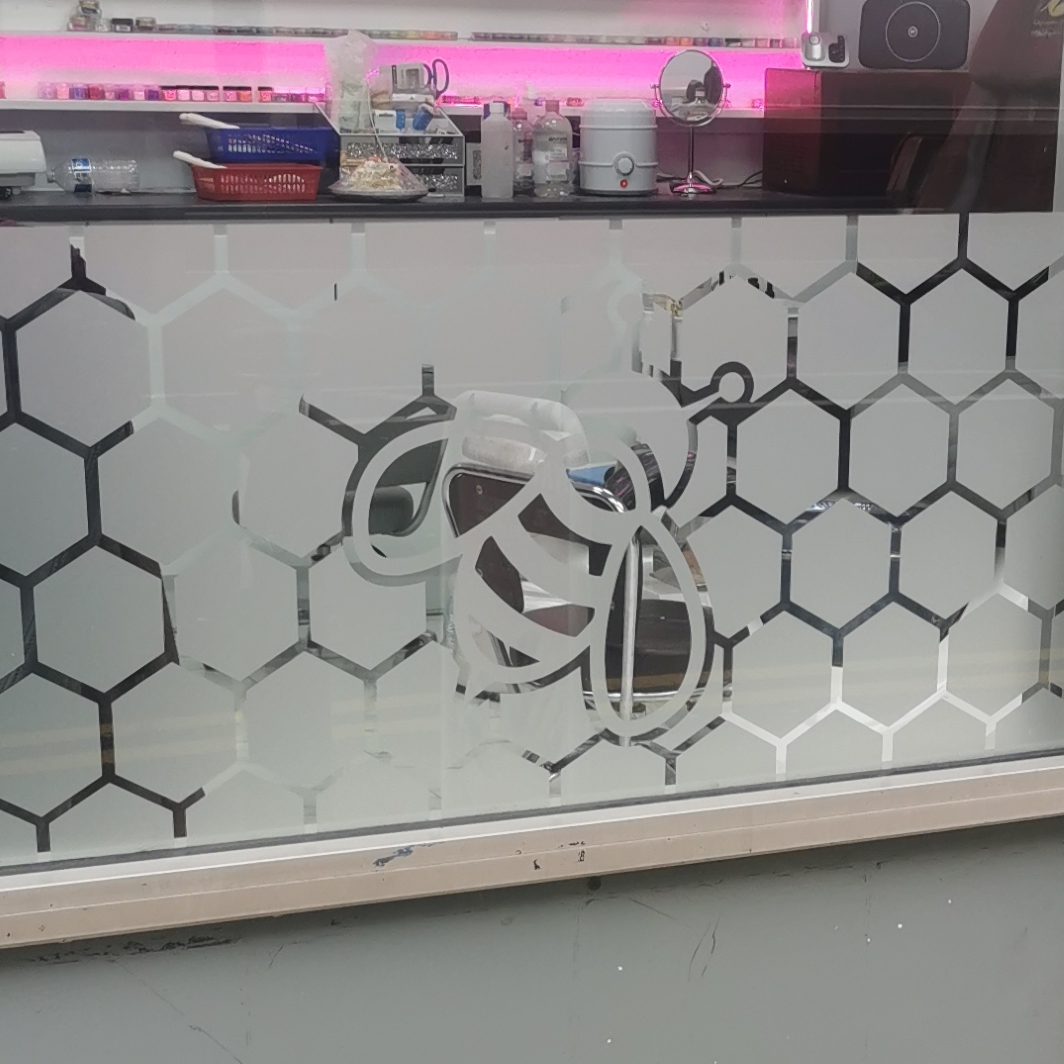 Bee in window at Nails Icon, Bridge Street