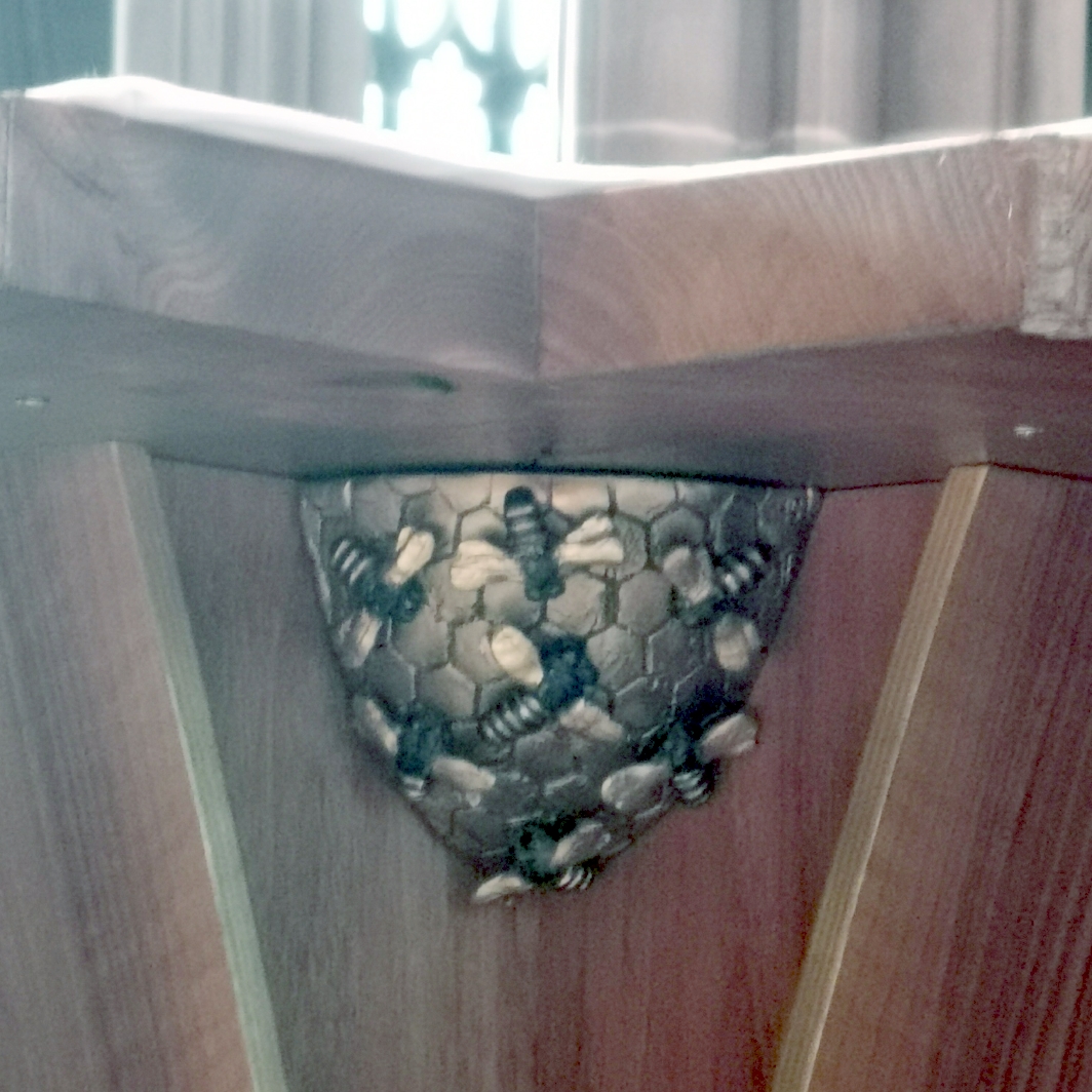 Bees on hive under the alter in main hall of Manchester Cathedral