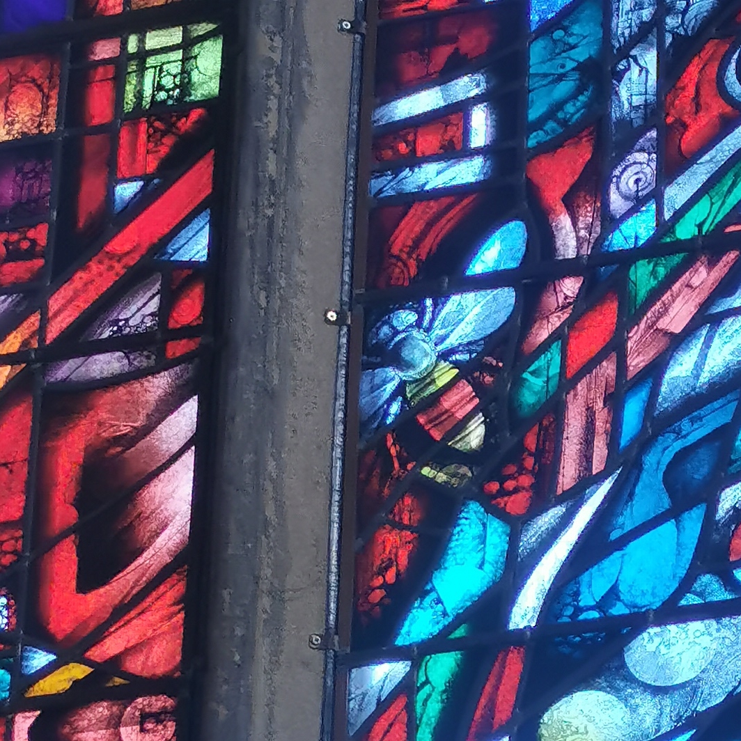 Bee in stained glass window in Manchester Cathedral