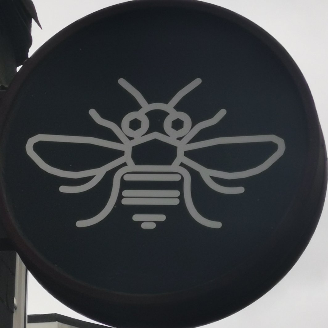 Bee on sign at Parlour Vapes, Chester Road