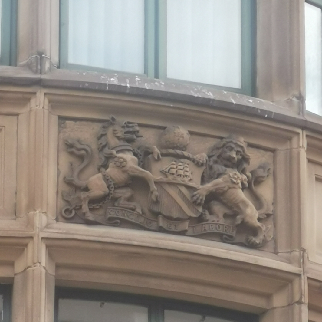 Bees on Manchester coat of arms Portland House, Portland Street