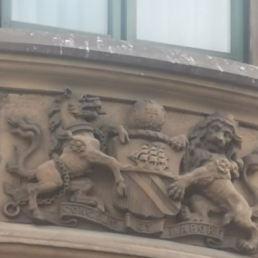 Close up of bees on Manchester coat of arms Portland House, Portland Street