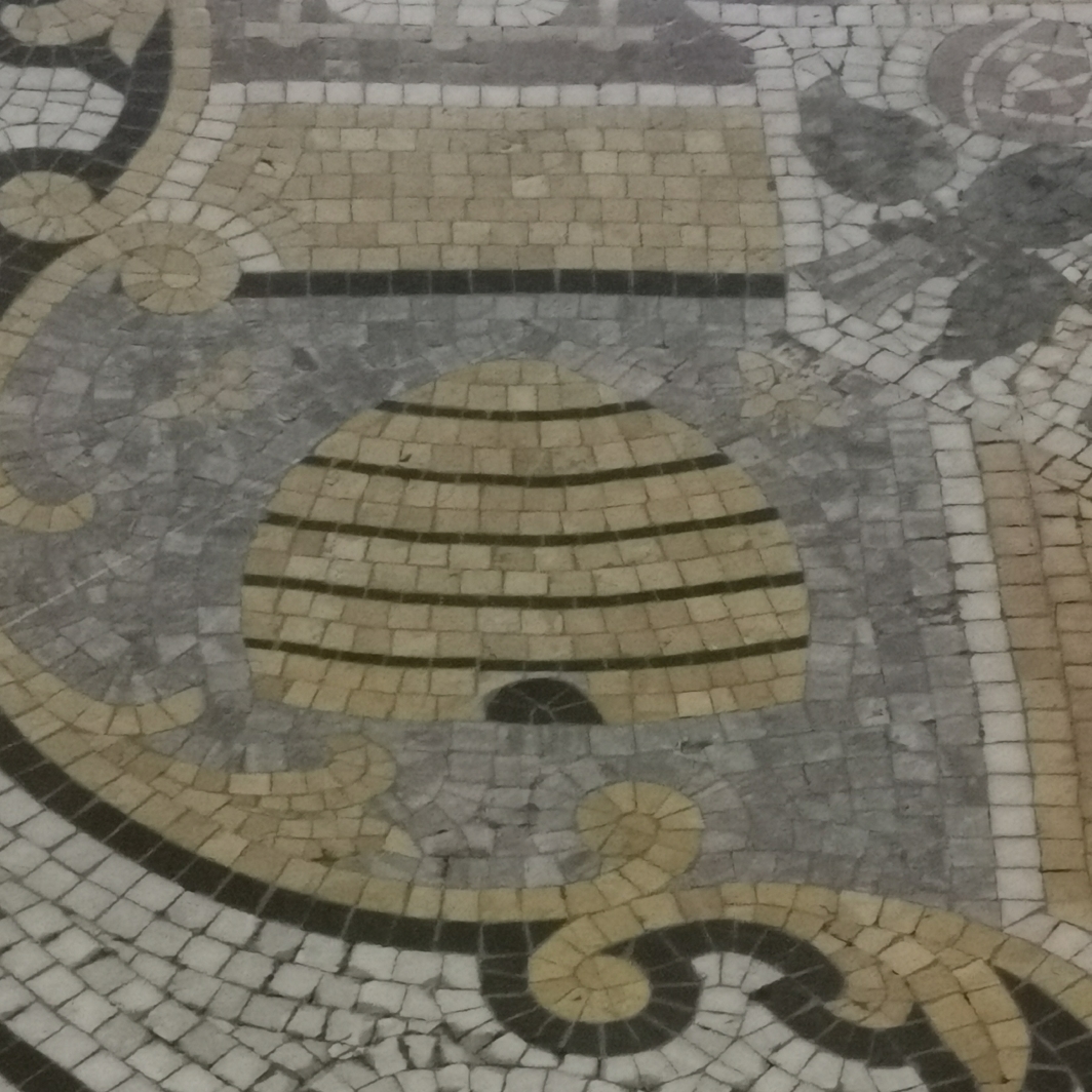 Close up of floor mosaic beehive and bees on Oddfellows coat of arms, inside Oddfellows Hall, Grosvenor Street