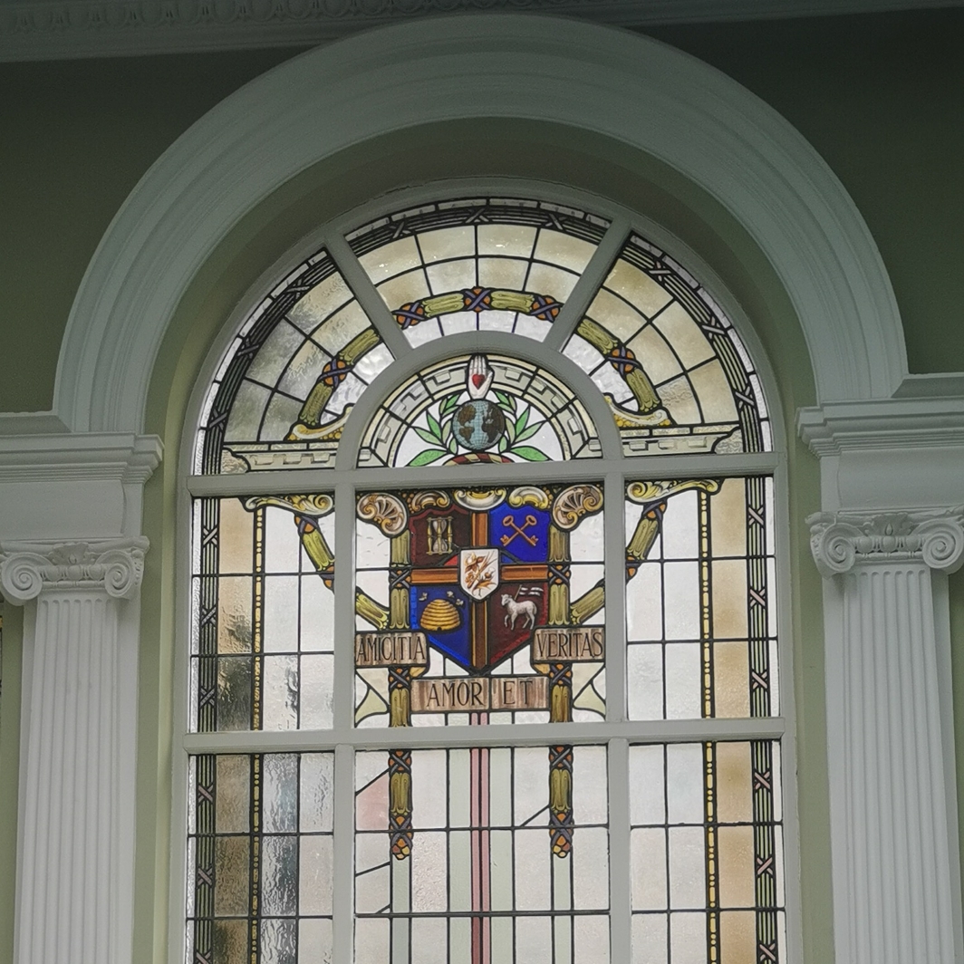 Stain glass window beehive and bees on Oddfellows coat of arms, inside Oddfellows Hall, Grosvenor Street